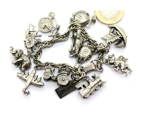 Charm bracelet with 12 charms, unmarked, 48g. P&amp;P Group 1 (£14+VAT for the first lot and £1+VAT for subsequent lots) 