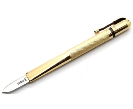Vernons K knife propelling penknife tubular form with pocket clip, the top turning to reveal the pointed steel blade, 1960s, 