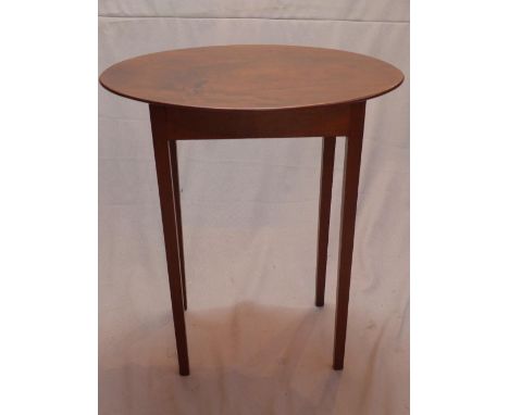 A late 19th century mahogany lamp table, raised on tapered legs 