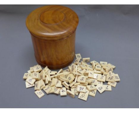A quantity of 19th century ivory numbered gaming counters within a satinwood tea caddy. In immaculate condition.