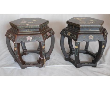 A pair of 20th century Chinese black lacquered hexagonal lamp tables, decorated with flora and fauna, H.47 W.47 D.52cm 