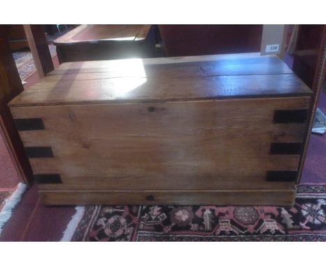 An early 20th century iron bound pine trunk, H.41 W.95 D.45cm 