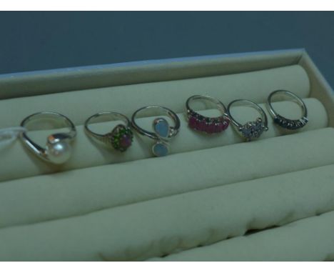 Six various silver rings, to include, opal, pearl, sapphire and tanzanite 