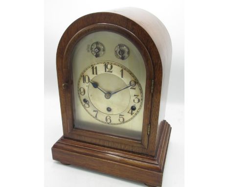 C20th arched top mahogany cased bracket clock, silvered dial with Arabic chapter and subsidiary slow/fast, chime/silent dials