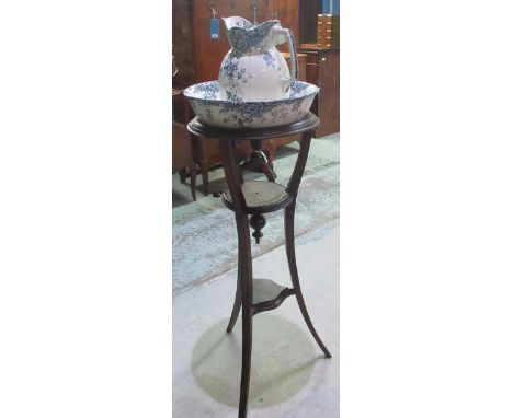 Early C20th mahogany circular top wash stand with ceramic jug and bowl 