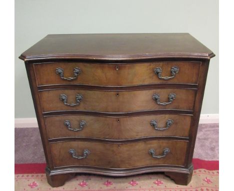 C20th Chippendale style serpentine front mahogany chest of four long graduated cockbeaded drawers with pierced and floral cas