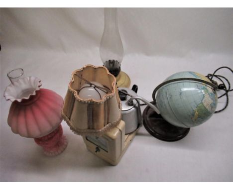 1960's Chad Valley tinplate terrestrial globe H29cm, vintage Hawkins Tecal teasmaid and two early C20th oil lamps 