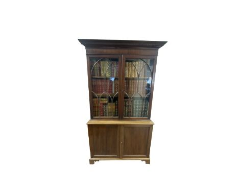 Geo. III mahogany side cabinet, with gadrooned cornice above pair of Gothic astragal glazed doors enclosing four adjustable s