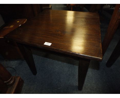 A LOW DARK OAK LAMP TABLE