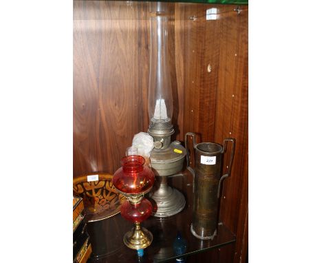 A TWIN HANDLED TRENCH ART VASE TOGETHER WITH AN ALLADIN OIL LAMP AND ANOTHER  (3)