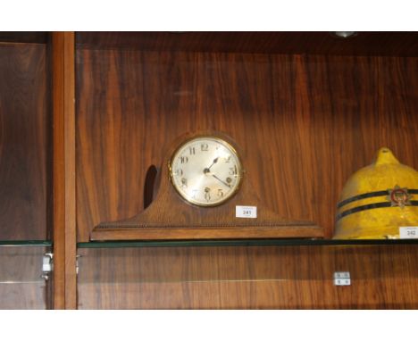 A GERMAN OAK HAT MANTEL CLOCK