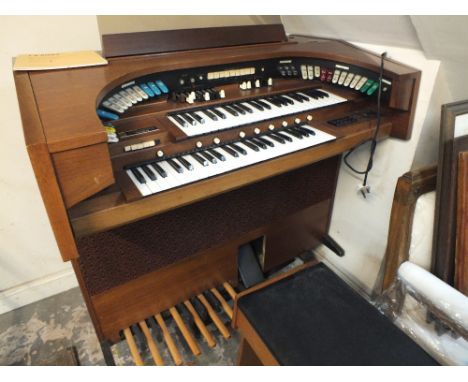 A RETRO ELECTRIC ORGAN AND STOOL WITH INSTRUCTION BOOK 'SHORT AND EASY PIECES FOR THE ORGAN' BY 'E A DICKS'