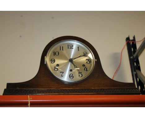 AN OAK NAPOLEON HAT MANTLE CLOCK