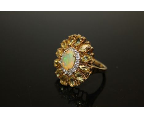 A LARGE GOLD PLATED STERLING SILVER DRESS RING SET WITH TOPAZ AND OPAL