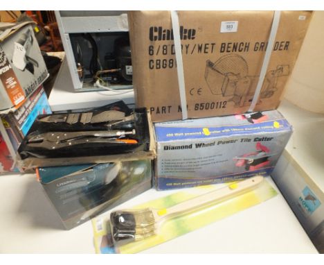 A BOXED CLARKE BENCH GRINDER, TILE CUTTER, CORDLESS TORCH ETC