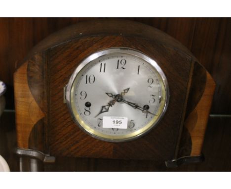 A WESTMINSTER CHIMES OAK MANTLE CLOCK