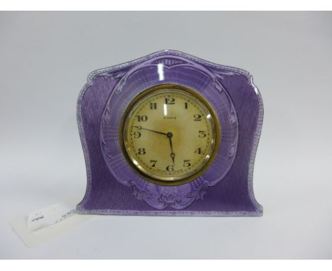George V silver and lilac enamel clock,  the silvered eight day dial with Arabic numerals, with easel strut back, Birmingham 