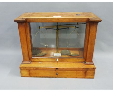 Becker's Sons, Rotterdam brass balance scales within a glass case, 40 x 32cm 