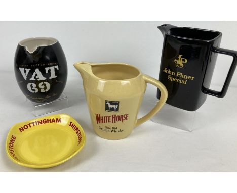 4 ceramic brewery advertising items, 3 water jugs and an ashtray. To include 2 Wade items and a Royal Norfolk Salesprint &amp