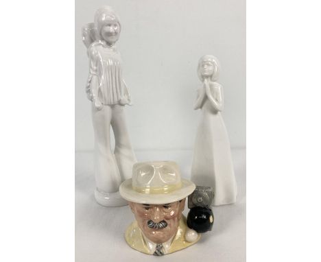 2 modern ceramic blanc de chine figurines together with a Royal Doulton "The Bowls Player" character jug #D6896. Figures comp