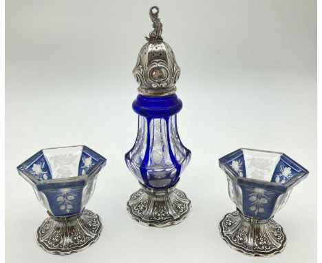 A vintage blue Bohemia glass and sterling silver hexagonal shaped 3 piece cruet. A silver footed sifter with blue overlaid gl