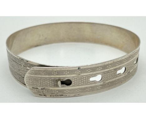 A vintage Charles Horner silver adjustable bangle in the form of a belt. With engine turned decoration, 13mm width. Fully hal