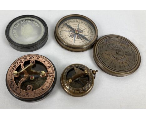 3 metal cased compasses. A large brass cased compass with screw top lid featuring a perpetual calendar (approx. 8cm diameter)