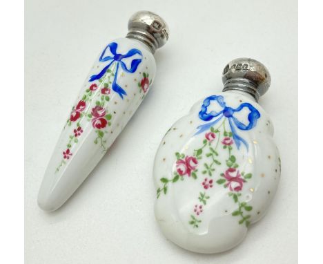 2 early 20th century ceramic scent bottles with hallmarked silver screw top lids. Shaped bottles featuring hand painted detai