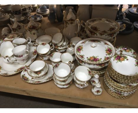 A Royal Albert Old English Country Rose tea and dinner set with extra ornaments tureens dinner plates tea pots cups and sauce