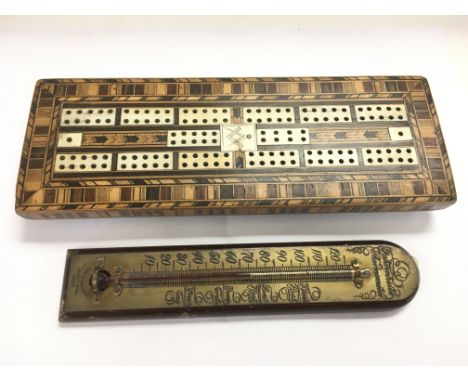 A Masonic cribbage board and a wooden and brass thermometer (2).
