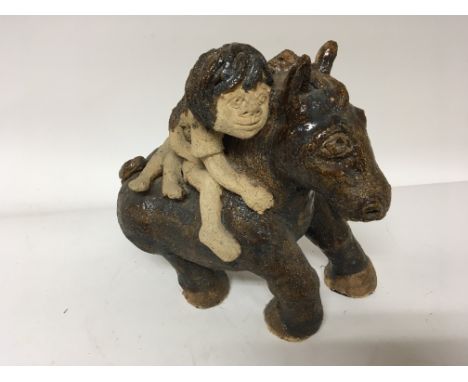 An unusual glazed pottery contemporary figure on a horse, height 31cm together with an ironstone China jug and basin some dam