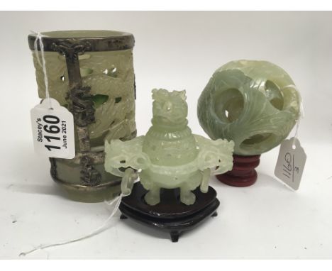 A carved jade vessel with ring handles a carved jade type puzzle ball and a metal mounted vase (3)