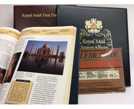 An album of Great Britain first day covers, an album of Great Britain Stamps together with other a National Geographic Atlas 