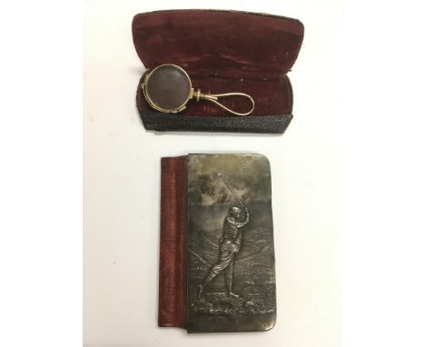 An old silver cased golf wallet, similar to one on display in St Andrews golf museum, together with a cased lorgnette (2).