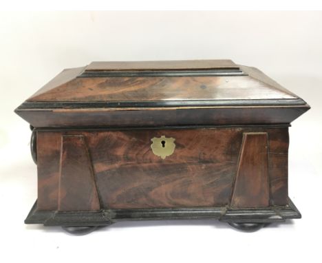 A stepped front mahogany tea caddy.