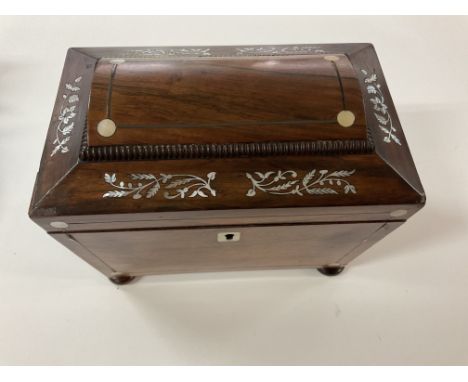 A small Rosewood and mother of Pearl inlay tea caddy.