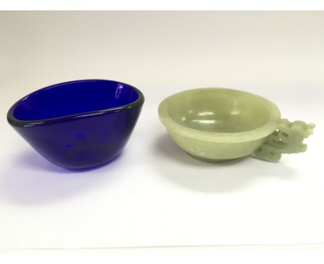 A jade bowl with dragon handle, approx diameter 10cm, and a blue glass bowl.