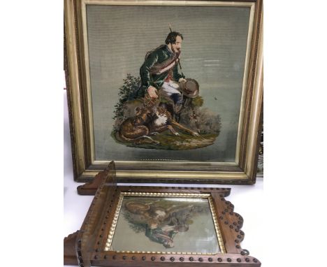 An oak mirror backed shelf with stud decoration together with a late 19th Century framed tapestry (2).