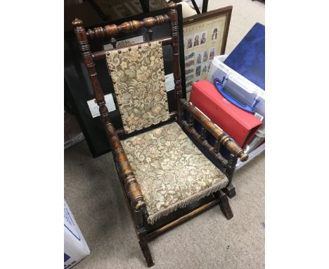 An American child's rocking chair with tapestry seat and back.