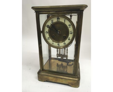 A late 19th century brass cased four glass clock with a Mercury thermometer striking on bell. Front glass door hinge not conn