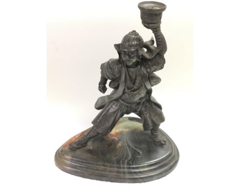 A bronzed figural candlestick of a Japanese warrior, approx 41cm.