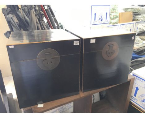 A pair of Chinese elm lacquered trunk both with brass swing handles and cloud shaped lock plates.