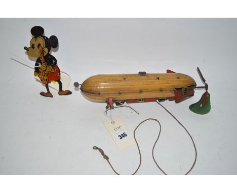 An early 20th Century lithograph printed clockwork powered tinplate model of a Zeppelin, probably German (incomplete); togeth