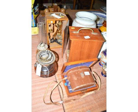 A brass cased microscope; a set of drawing instruments in mahogany case; a pair of Keiner binoculars, in fitted leather case;