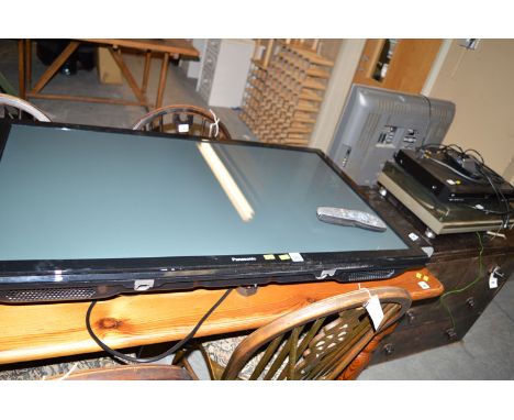 A Panasonic flatscreen television; together with a Sky HD box; a Panasonic digital box; and a Quanta 700 record player.