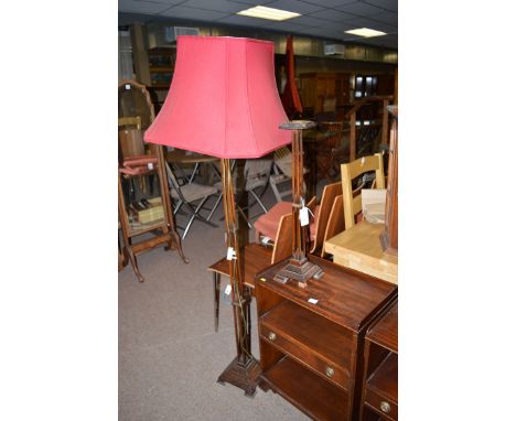 A stained oak standard lamp with spindle stem and stepped base; together with matching smoker's stand.