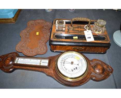 A Victorian figured walnut, ebonised and brass mounted pen and ink stand with two ink stands, one missing its cover; together