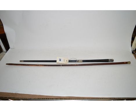 An ebony silver mounted conductor's baton (missing its finial); together with a military swagger stick.