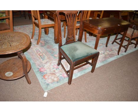 A modern Chinese carpet with floral central medallion on duck-egg blue ground, surrounded by further floral motifs.