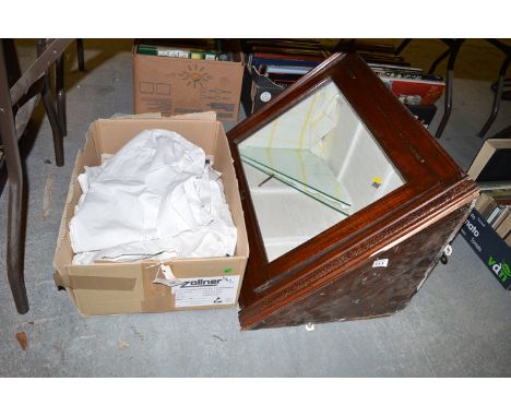 A box of vintage clothing; etc; and a stained wood hanging corner cabinet, the frieze decorated with floral motifs above a gl